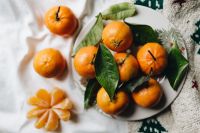 Kaboompics - Still life of mandarin oranges with leaves