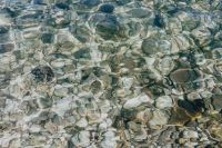 Kaboompics - A close-up of stones in turquoise water, Isola, Slovenia