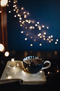 Kaboompics - Cup of coffee, book, fairy lights