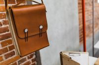 Kaboompics - Architecture plans in an elegant leather bag