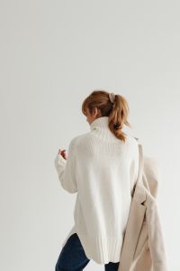 Kaboompics - Woman in white sweater - beige wool jacket - jeans