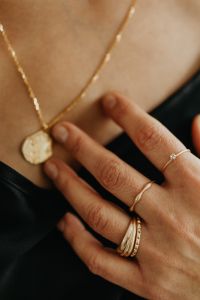 Kaboompics - Jewelry photo shoot - woman wearing gold rings and necklace