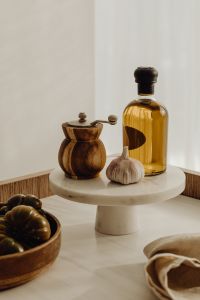 Kaboompics - Oil, garlic and pepper shaker on the etagere