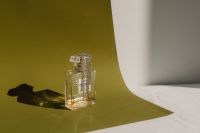 Refined Aromas: Perfume Bottles Cast in Shadows and Light
