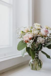 A small pastel bouquet in a glass vase