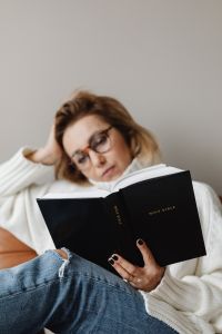 A middle-aged woman reads her bible