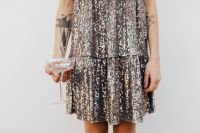 Kaboompics - Woman in a Sequin Dress is Holding a Glass of Champagne, White Background