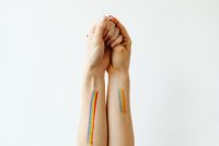 Kaboompics - Girls paint an LGBT rainbow on their bodies