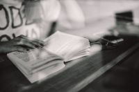 Kaboompics - Woman reading book at coffee shop