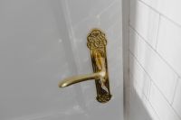 Kaboompics - Antique gold plated door handle